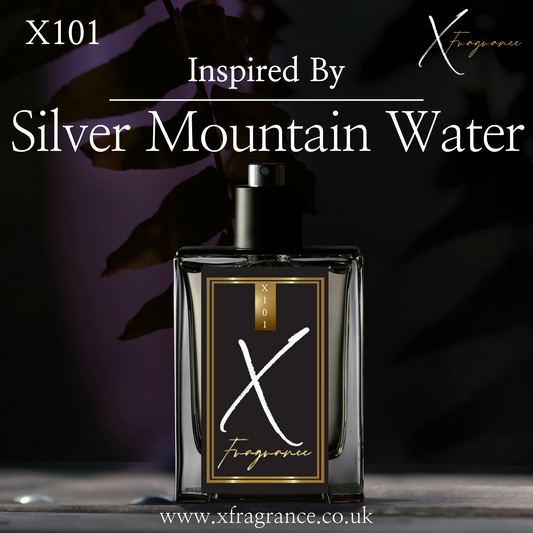 Designer-inspired perfume bottle with 'X101' and 'Inspired By Silver Mountain Water' text against an elegant backdrop with leaf silhouettes.